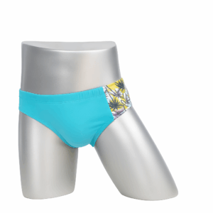 Bañador deportivo WIJO 🩲 azul con detalle tropical. Modelo en maniquí plateado, fondo blanco.